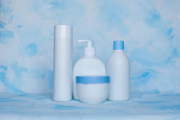 A set of white, plastic, containers. Packaging, bottle template for cosmetics, antiseptic, with detergents and chemical cleaners, for medical and cosmetic products. Spray