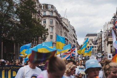 London / UK - 02/07/2022: Ukrainian people with flags and banners celebrating London LGBTQ Pride Parade