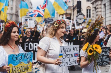 London / UK - 02/07/2022: Ukrainian people with flags and banners celebrating London LGBTQ Pride Parade