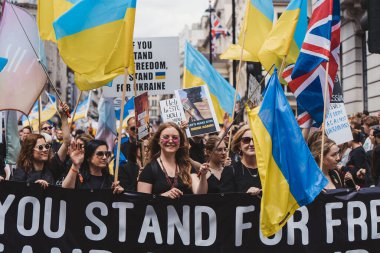 London / UK - 02/07/2022: Ukrainian people with flags and banners celebrating London LGBTQ Pride Parade