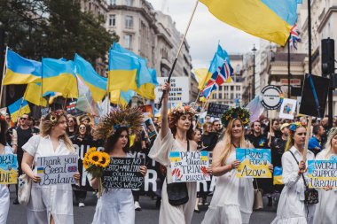 London / UK - 02/07/2022: Ukrainian people with flags and banners celebrating London LGBTQ Pride Parade