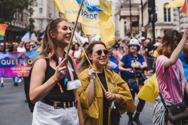 London / UK - 02/07/2022: Ukrainian people with flags and banners celebrating London LGBTQ Pride Parade