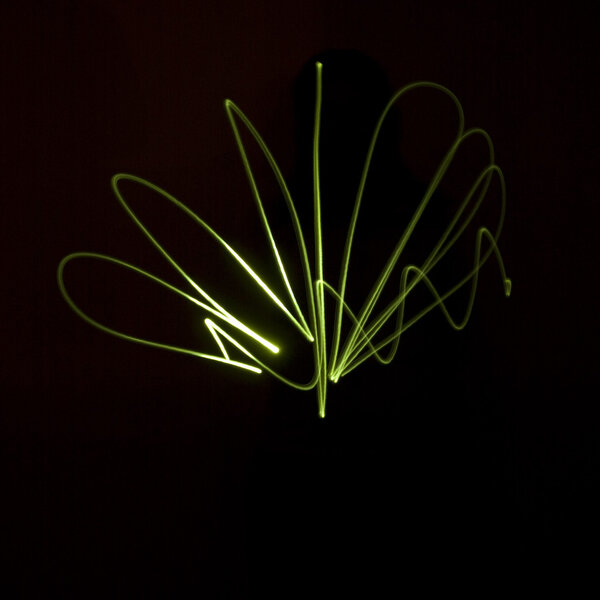 Wavy abstract green laser light.
