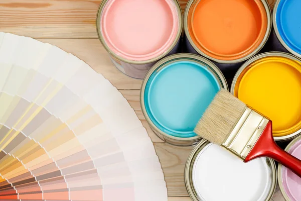 A painter is choosing a paint shade for the interior of the house\'s walls. with interior