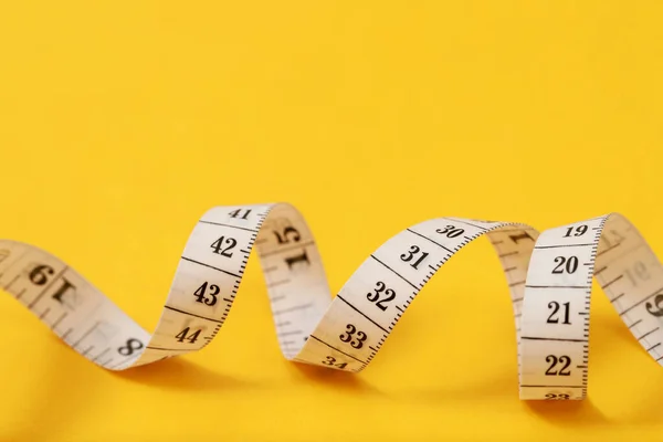 Tape Measure Obese People Yellow Background Soft Focus — Stock Photo, Image