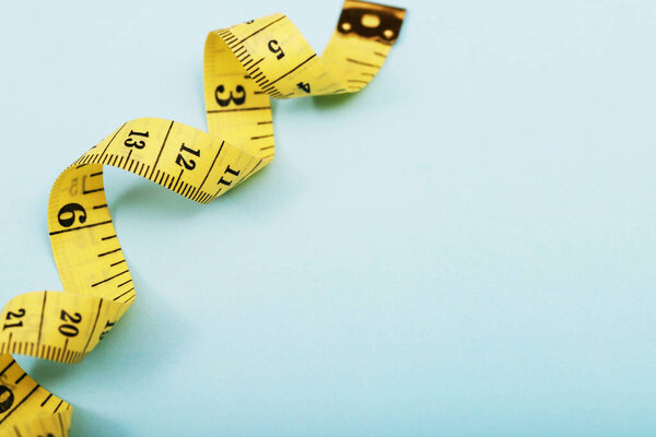 tape measure for obese people on a blue background