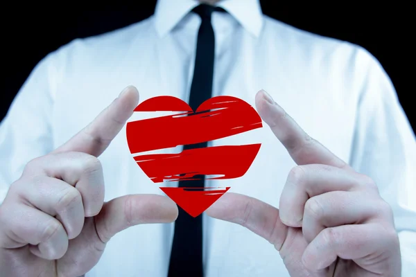 Businessman with heart icon — Stock Photo, Image