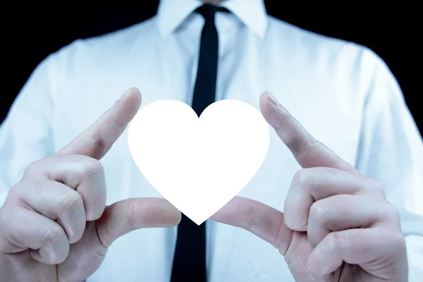 Businessman with heart icon — Stock Photo, Image