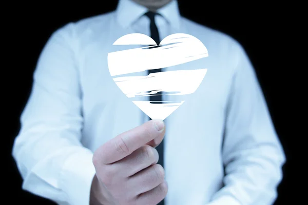 Businessman with heart icon — Stock Photo, Image