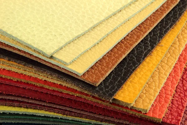 Natural leather upholstery samples with stitching in various colors — Stock Photo, Image