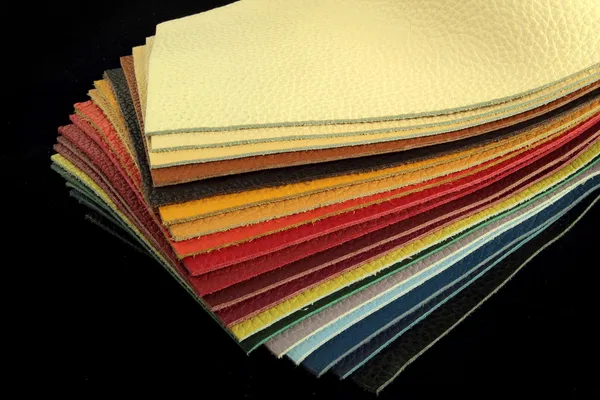 Natural leather upholstery samples with stitching in various colors — Stock Photo, Image