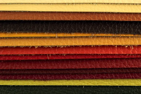 Natural leather upholstery samples with stitching in various colors — Stock Photo, Image