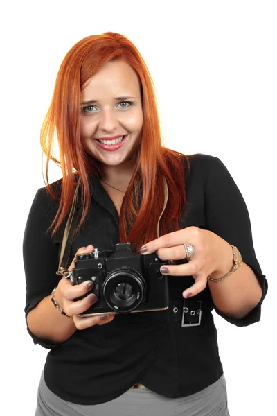 Sorridente giovane donna con vecchia macchina fotografica — Foto Stock