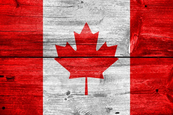 Canada flag painted on old wood plank background — Stock Photo, Image