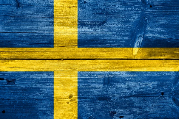 Sweden Flag painted on old wood plank background — Stock Photo, Image