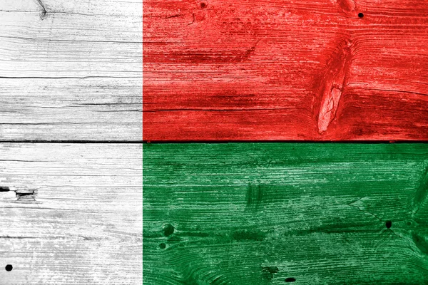 Madagascar Flag painted on old wood plank background — Stock Photo, Image