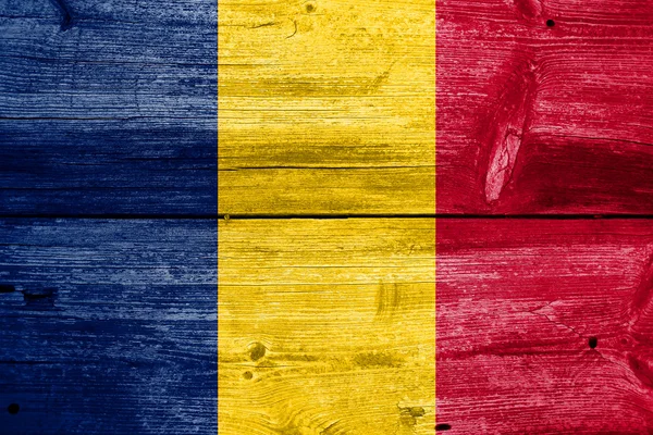 Chad Flag painted on old wood plank background — Stock Photo, Image