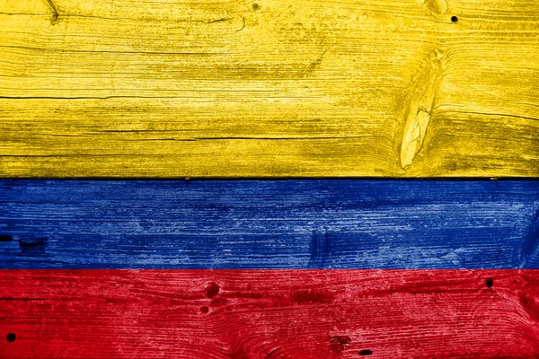 Colombia Flag painted on old wood plank background — Stock Photo, Image