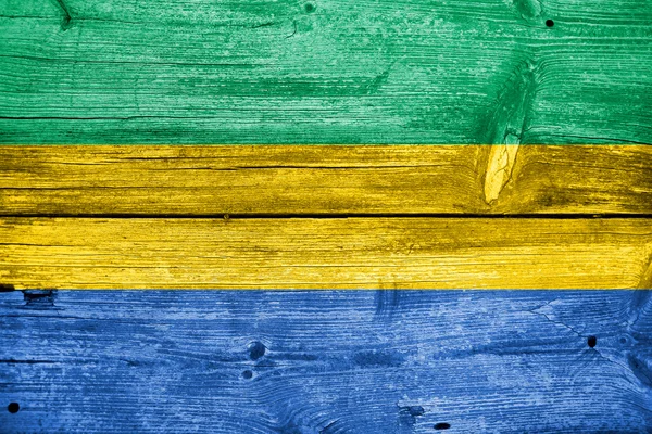 Gabon Drapeau peint sur un vieux fond de planche de bois — Photo