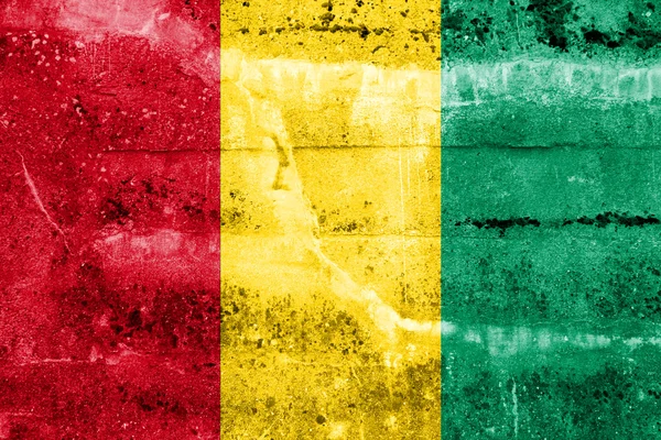 Guinea-Flagge an Grunge-Wand gemalt — Stockfoto