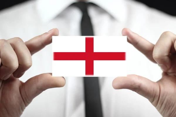 Podnikatel drží vizitku s Anglii vlajky — Stock fotografie