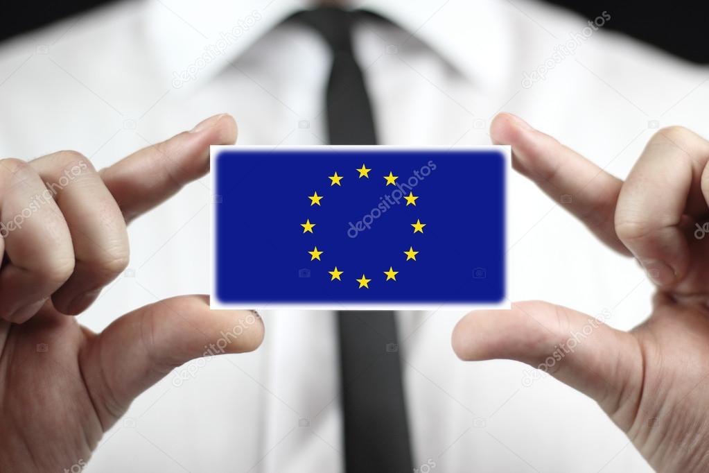 Businessman holding a business card with a EU Flag