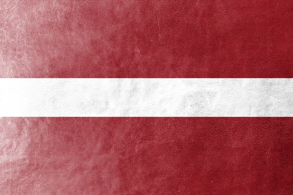 Lettlands flagga målade på läder texture — Stockfoto