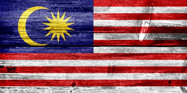 Malaysia Flagge auf alten Holzplanken bemalt — Stockfoto