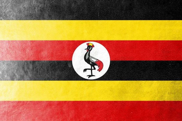 Ugandas Flagge auf Lederstruktur gemalt — Stockfoto