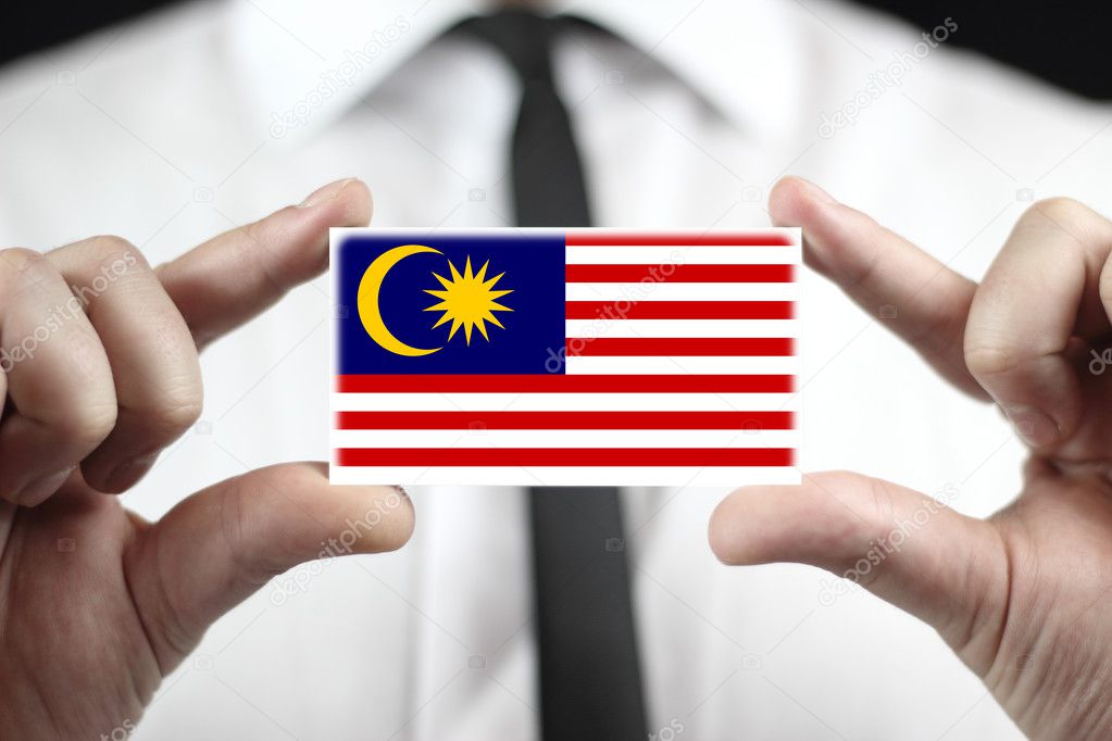 Businessman holding a business card with Malaysia Flag