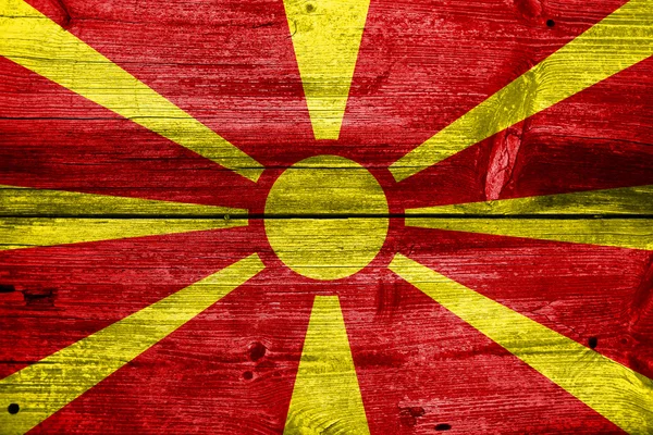 Macedonia Bandera pintada sobre madera vieja textura del tablón — Foto de Stock