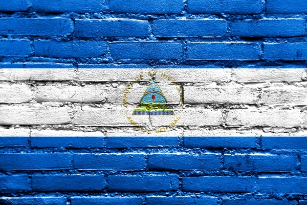Nicarágua Bandeira pintada na parede de tijolo — Fotografia de Stock