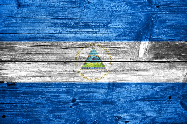 Nicaragua Flag painted on old wood plank texture — Stock Photo, Image
