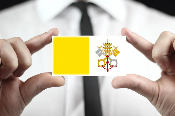 Empresario con tarjeta de visita con bandera de la Ciudad del Vaticano — Foto de Stock