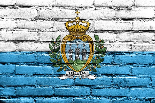 San Marino Bandeira pintada na parede de tijolo — Fotografia de Stock