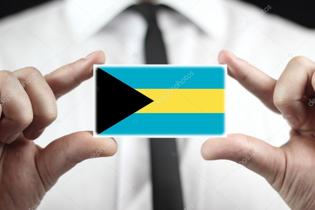 Businessman holding a business card with Bahamas Flag