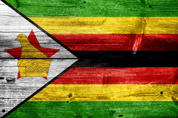 Zimbabwe Flag painted on old wood plank texture — Stock Photo, Image