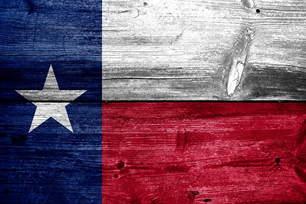 德克萨斯州州旗在旧木板纹理上绘制 — 图库照片