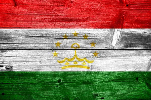 Tajikistan Flag painted on old wood plank texture — Stock Photo, Image