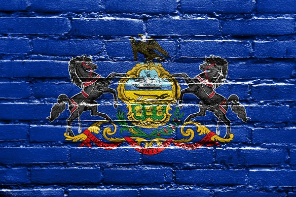 Drapeau d'État de Pennsylvanie peint sur un mur de briques — Photo