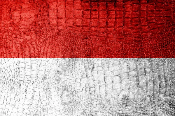 Monaco-Flagge auf Luxus-Krokodilstruktur gemalt — Stockfoto