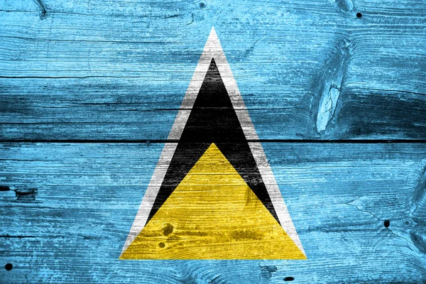Saint Lucia Flag painted on old wood plank texture — Stock Photo, Image