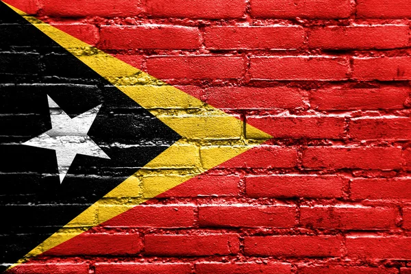 East Timor Flag painted on brick wall — Stock Photo, Image