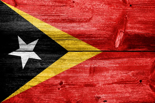 Timor-Leste Bandeira pintada em madeira velha prancha textura — Fotografia de Stock