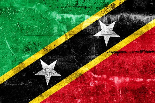 Saint kitts och nevis flagga målade på grunge vägg — Stockfoto