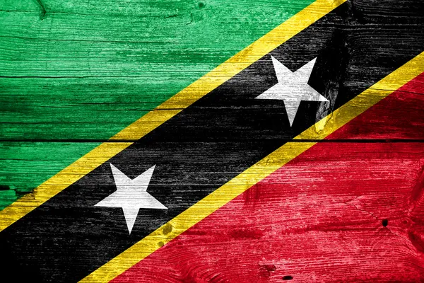 Saint kitts en nevis vlag geschilderd op oude houten plank textuur — Stockfoto