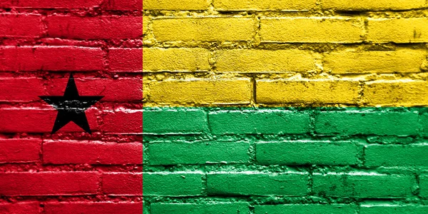 几内亚几内亚比绍国旗画在砖墙上 — 图库照片