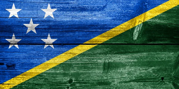 Solomon Islands Flag painted on old wood plank texture — Stok fotoğraf