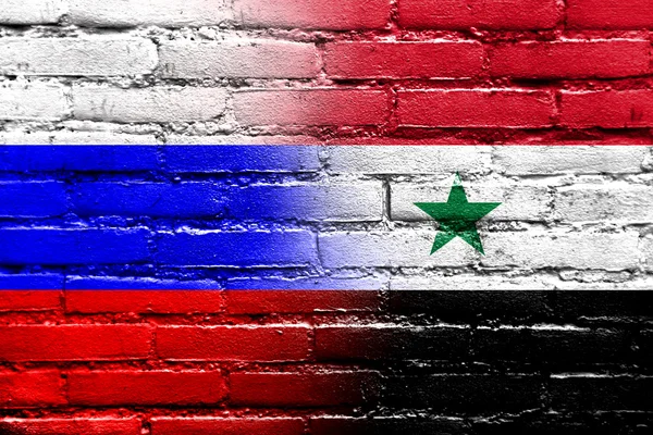 Russie et Syrie Drapeau peint sur un mur de briques — Photo