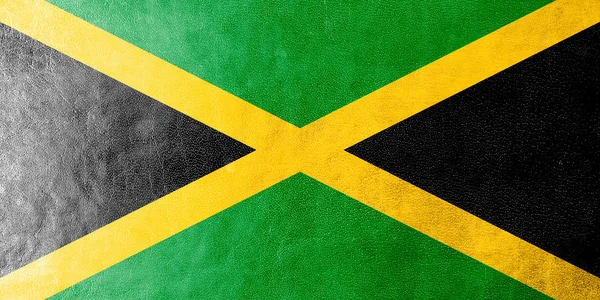 Jamaica Bandeira pintada sobre textura de couro — Fotografia de Stock